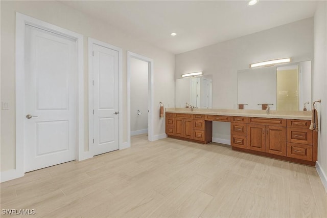 bathroom featuring wood-type flooring and vanity