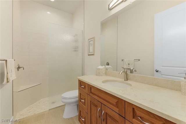 bathroom with a shower, toilet, and vanity