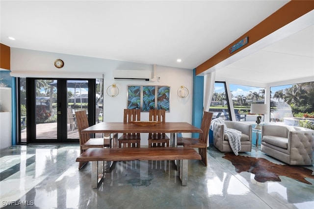 dining room featuring a wall mounted air conditioner, vaulted ceiling, and french doors