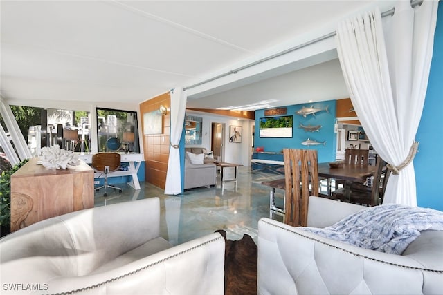 living room featuring concrete floors