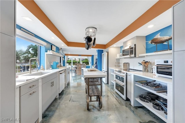 kitchen with white cabinets, sink, and stainless steel appliances