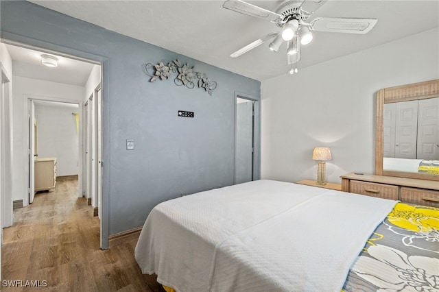 bedroom featuring ceiling fan and hardwood / wood-style flooring