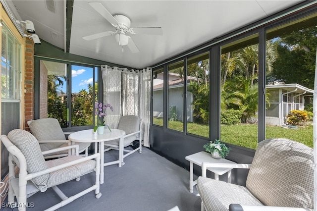 sunroom with a wealth of natural light and ceiling fan