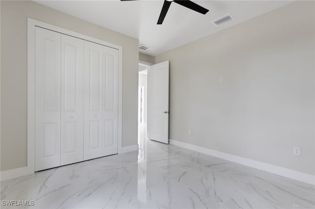 unfurnished bedroom featuring a closet and ceiling fan