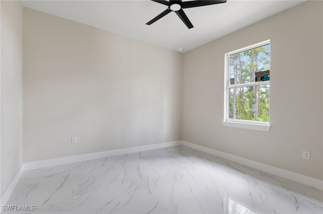 spare room with ceiling fan