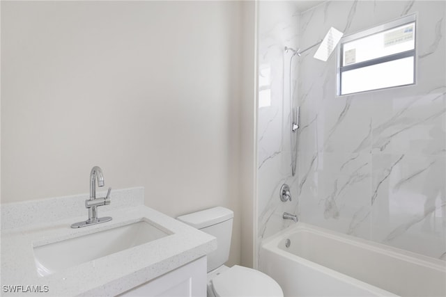 full bathroom with toilet, vanity, and tiled shower / bath combo