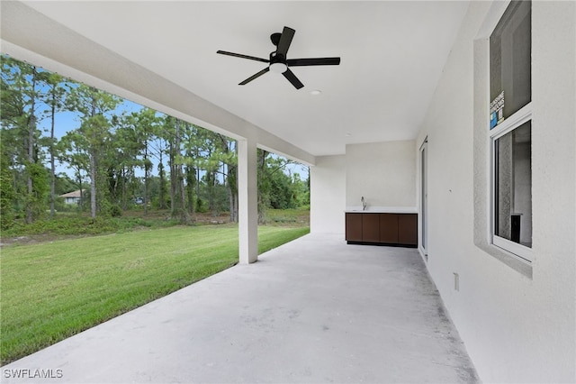 view of patio with ceiling fan