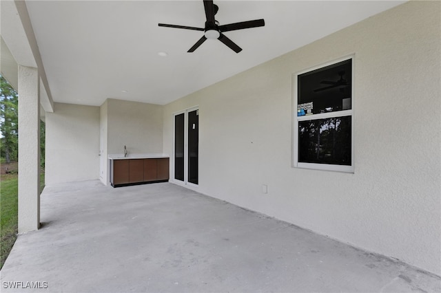 view of patio with ceiling fan