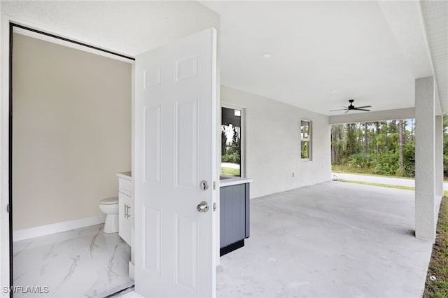 interior space featuring ceiling fan