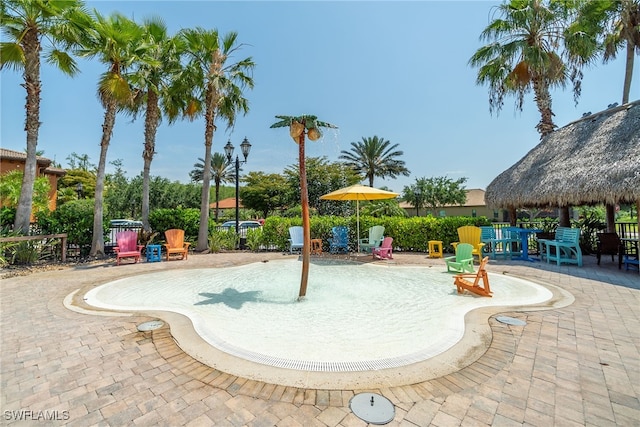 view of swimming pool with a gazebo and a patio