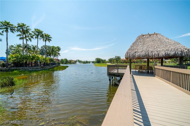 view of dock featuring a gazebo and a water view