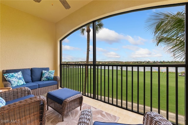 balcony with an outdoor hangout area and ceiling fan