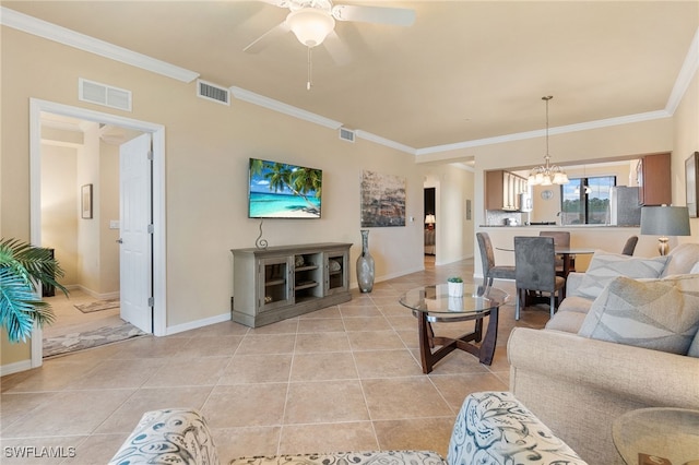 tiled living room with crown molding and ceiling fan with notable chandelier