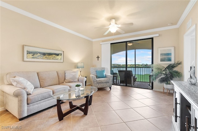 living room featuring ceiling fan, light tile patterned floors, and ornamental molding