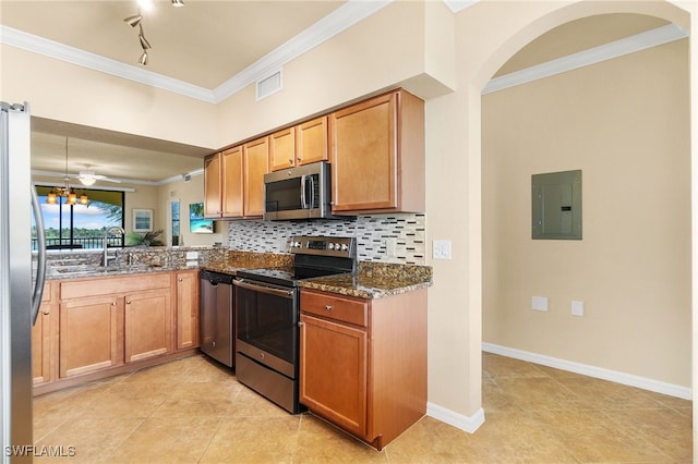 kitchen with sink, crown molding, appliances with stainless steel finishes, electric panel, and dark stone counters