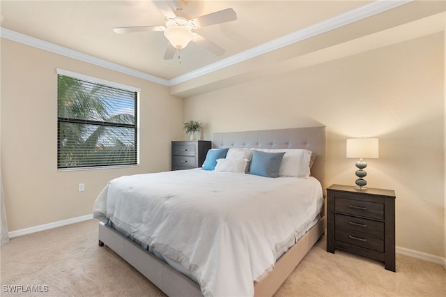 carpeted bedroom with ornamental molding and ceiling fan