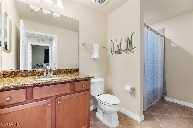 bathroom with tile patterned flooring, vanity, a shower with shower curtain, and toilet