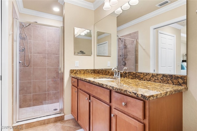 bathroom featuring walk in shower, ornamental molding, tile patterned flooring, and vanity