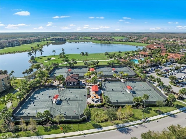 birds eye view of property with a water view