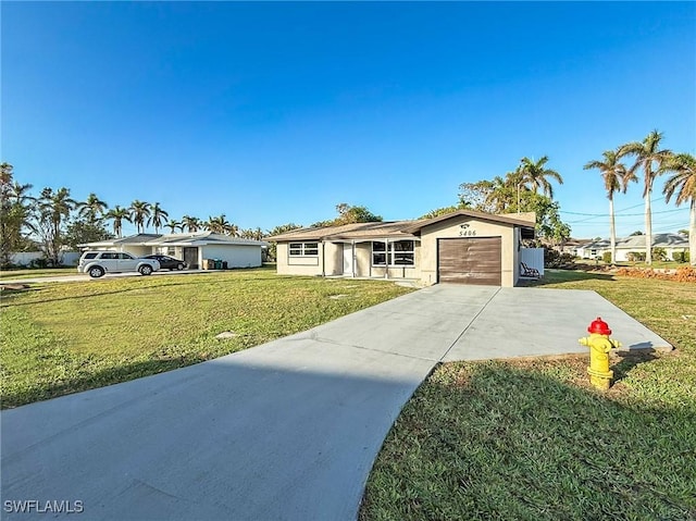 ranch-style home with a front yard and a garage