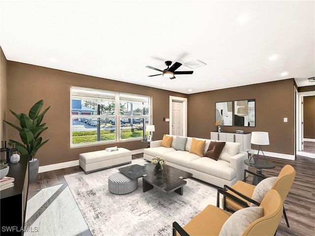 living room featuring ceiling fan and wood-type flooring