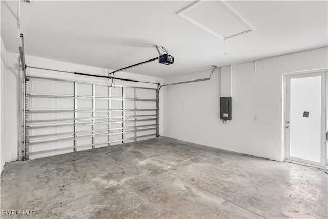 garage featuring electric panel and a garage door opener