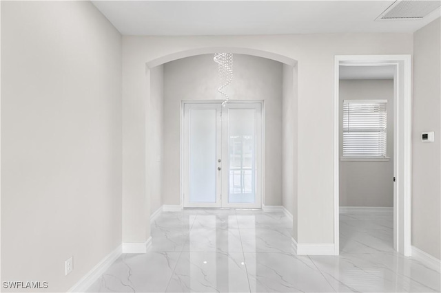 foyer entrance featuring french doors