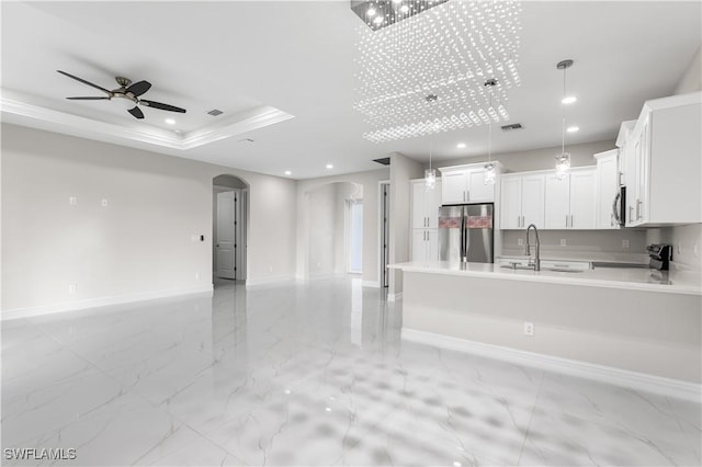 kitchen with stainless steel appliances, ceiling fan, sink, decorative light fixtures, and white cabinets