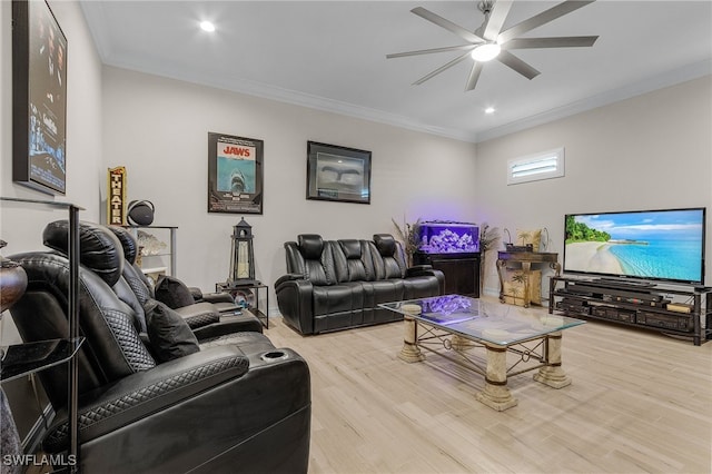 living room featuring light wood-type flooring, ceiling fan, and ornamental molding