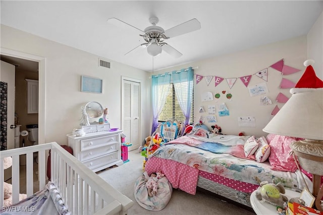 bedroom featuring carpet, ceiling fan, and a closet