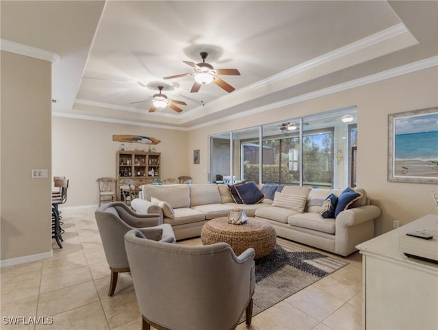 tiled living room featuring a raised ceiling and crown molding