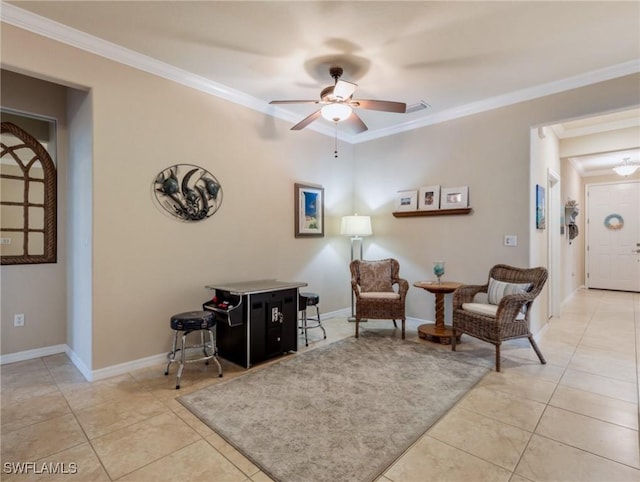 sitting room featuring ceiling fan, light tile patterned floors, and crown molding