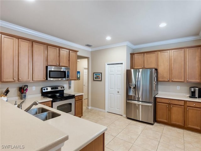 kitchen with light tile patterned flooring, appliances with stainless steel finishes, ornamental molding, and sink