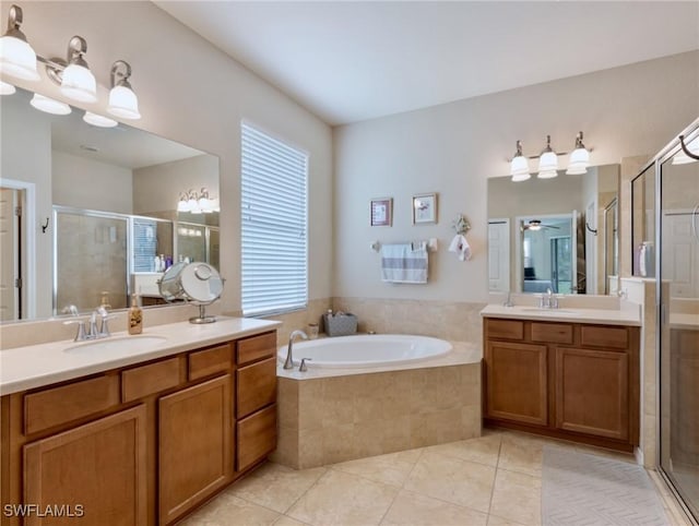 bathroom featuring tile patterned flooring, vanity, separate shower and tub, and ceiling fan