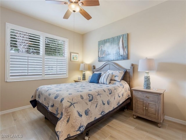 bedroom featuring light wood-type flooring and ceiling fan