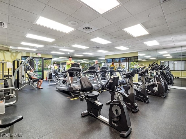 exercise room with a paneled ceiling