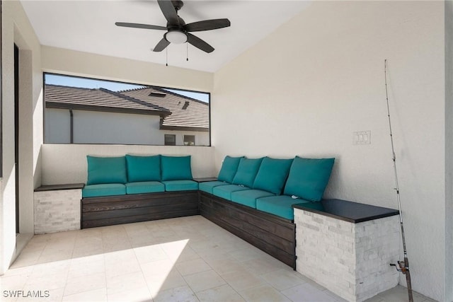 unfurnished living room with ceiling fan