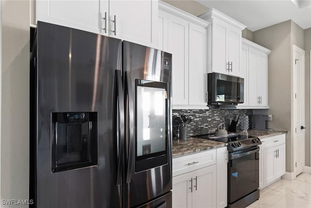 kitchen featuring backsplash, dark stone countertops, white cabinets, and stainless steel appliances