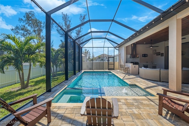 605 SW 39th Ave, Cape Coral, FL 33991 - view of pool featuring exterior kitchen, a patio area, ceiling fan, and glass enclosure