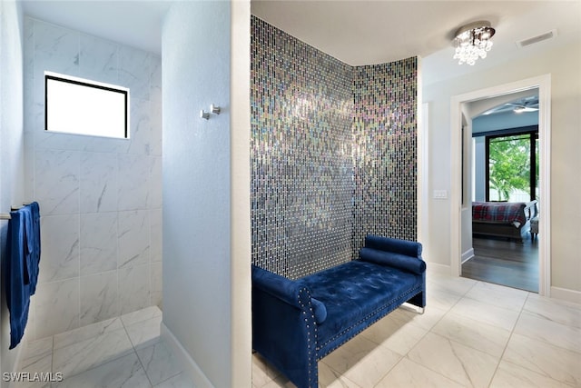 bathroom featuring tiled shower