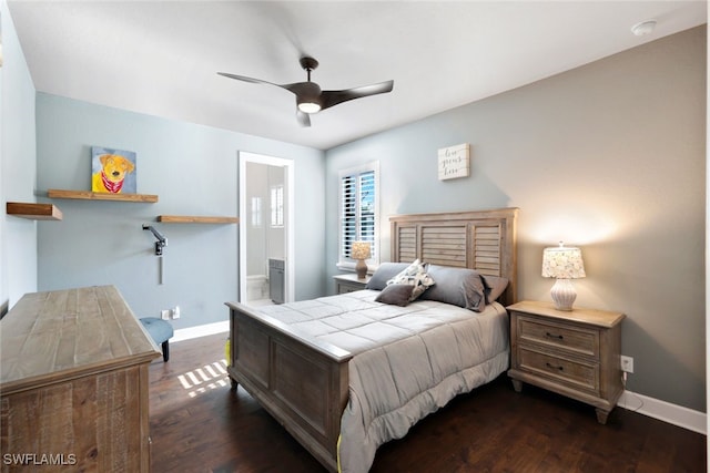 bedroom featuring ceiling fan, dark hardwood / wood-style flooring, and ensuite bath