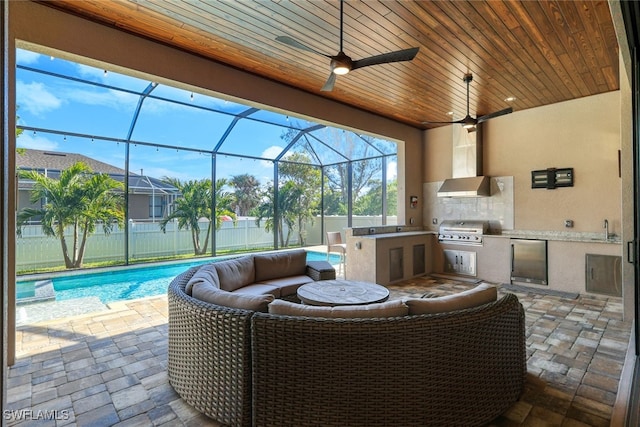 view of patio featuring sink, a fenced in pool, glass enclosure, and area for grilling