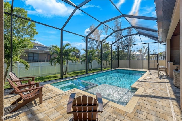 view of swimming pool featuring a lanai and a patio