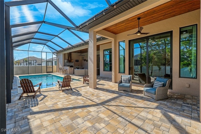 view of pool featuring ceiling fan, a lanai, area for grilling, and a patio