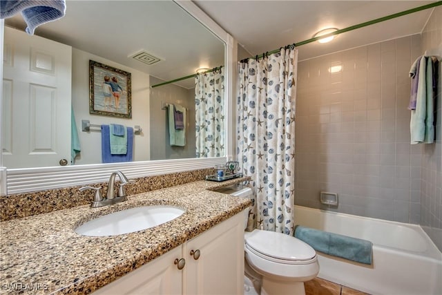 full bathroom featuring shower / tub combo with curtain, vanity, and toilet