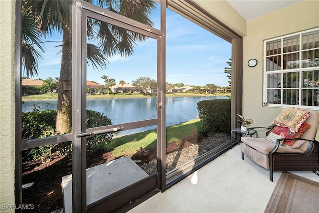 sunroom with a water view