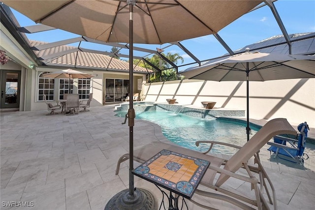 view of swimming pool with glass enclosure, pool water feature, and a patio