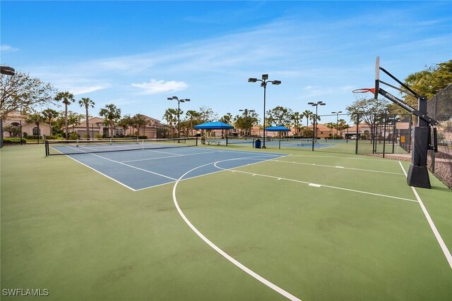 view of basketball court featuring tennis court