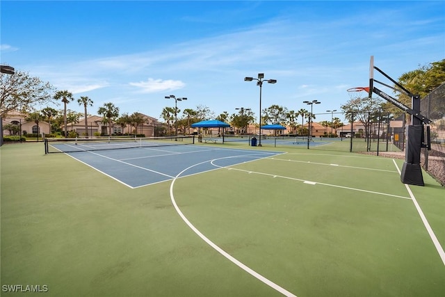 view of sport court featuring tennis court