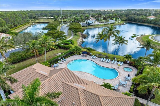 view of swimming pool featuring a water view